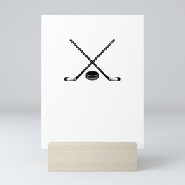 ice hockey bat and puck Mini Art Print