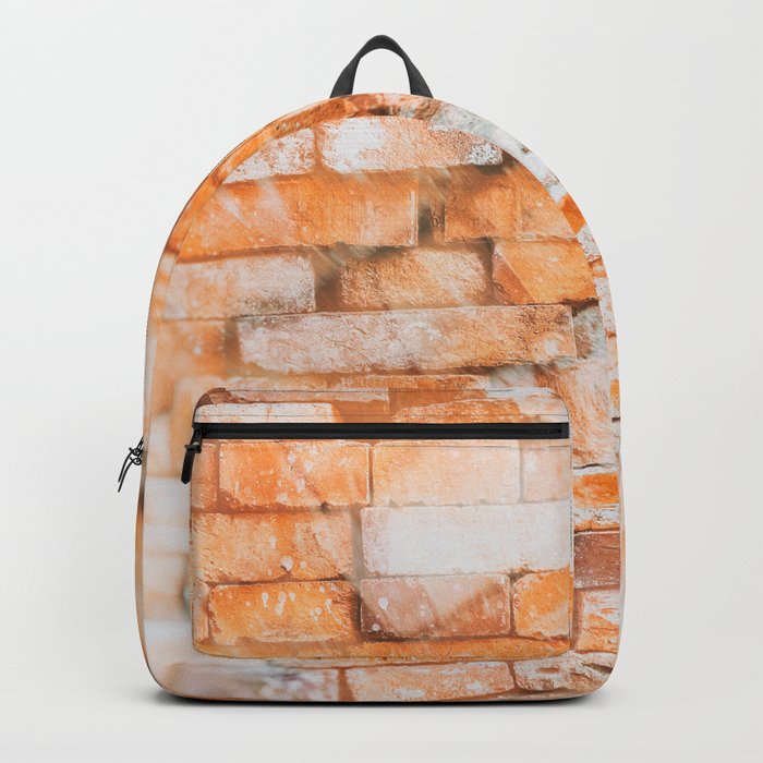 Retro style background or texture in double exposure. The stonewall from old orange bricks.  Backpack