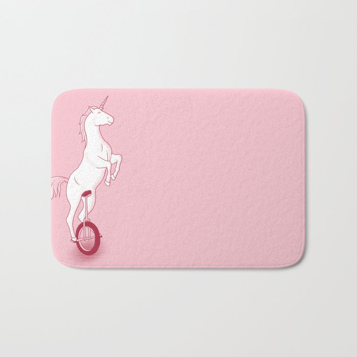 Unicorn on a unicycle - pink Bath Mat