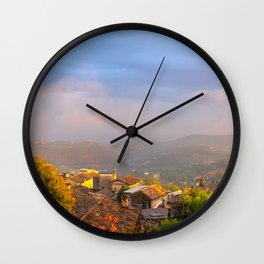 SUnset over the old roofs Wall Clock