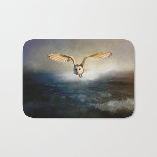 An owl flies over the lake Bath Mat