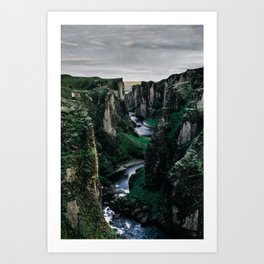 Fast flowing river making (wending) it’s way between two massive rock formations Art Print