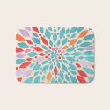Coral and teal area rug