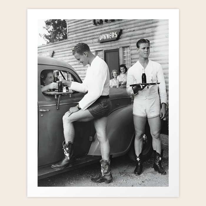 Texas love, male drivein car hops in shorts and cowboy boots at drive