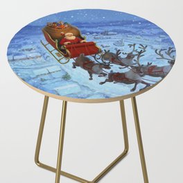 Santa flying over the snowy countryside on Christmas Eve Side Table