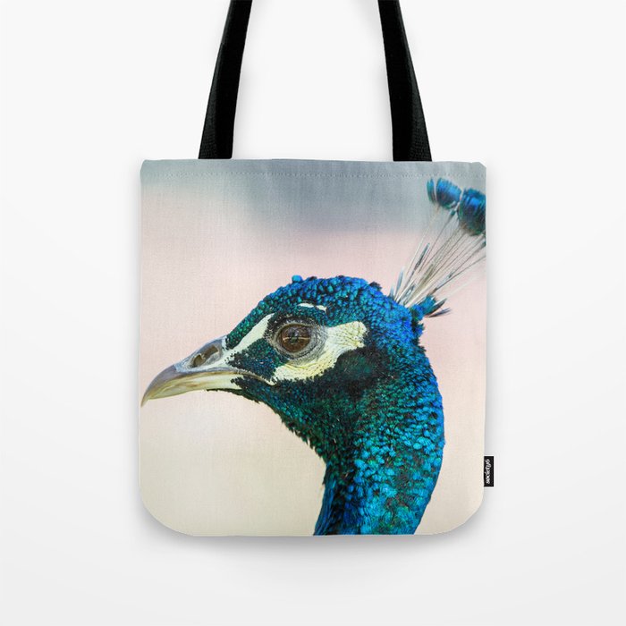 Peacock head against bright background Tote Bag