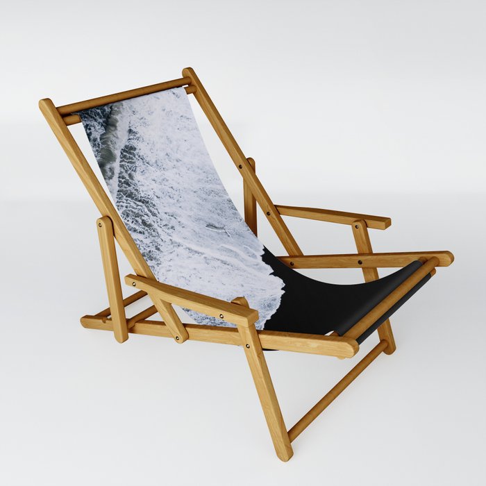 Waves crashing on a black sand beach Sling Chair