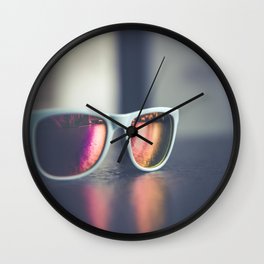 Sunglasses on a table Wall Clock