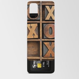 tic-tac-toe or noughts and crosses game - vintage letterpress ing block X and O in wooden grunge typesetter box with dividers Android Card Case