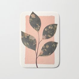 Dark leaf design, pink background Bath Mat