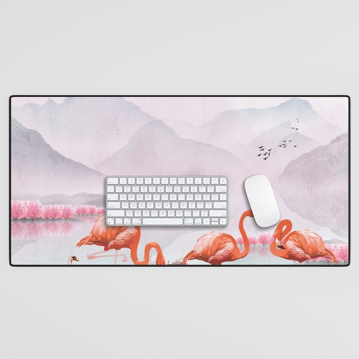 Flocks of flamingo with a pair of swans in the pink trees and mountains landscape Desk Mat