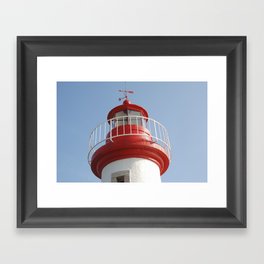 Lighthouse on a blue sky Framed Art Print