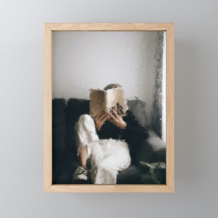 digital oil painting of a faceless woman reading on a sofa Framed Mini Art Print