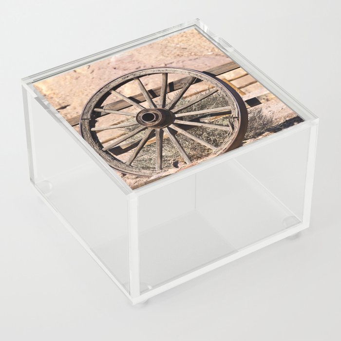Old wagon wheel against a fence Acrylic Box