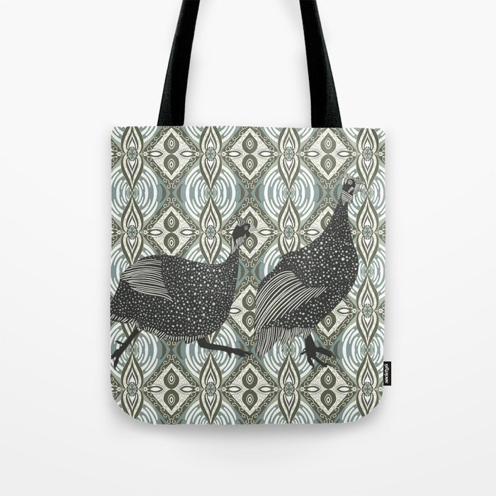 Guinea fowl from the African savannah walking on a patterned background Tote Bag
