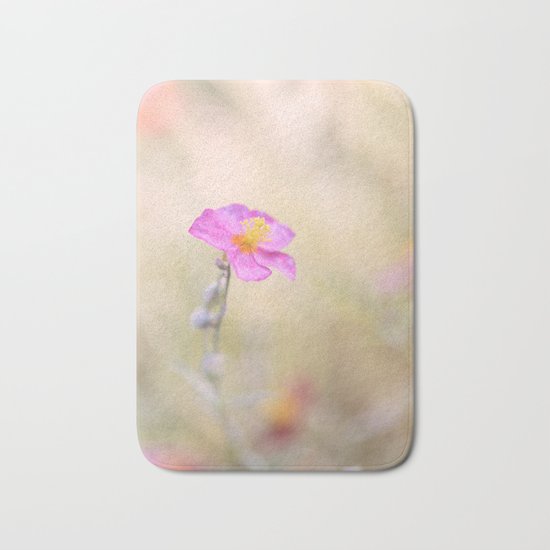 Lovely pink flower against backlit Bath Mat