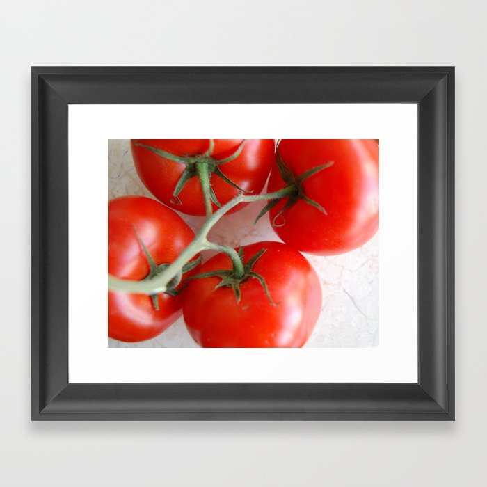 Tomatoes on the vine on marble board Framed Art Print