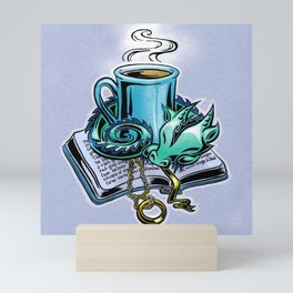 Snuggly dragon and a coffee cup Mini Art Print