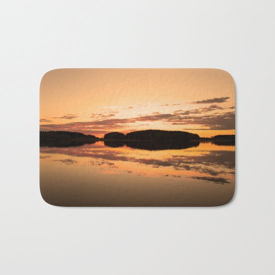 Beautiful sunset - glowing orange - forest silhouette and reflection Bath Mat