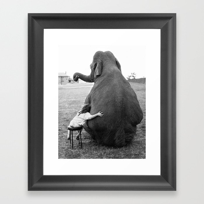 Odd Best Friends, Sweet Little Girl hugging elephant black and white photograph Framed Art Print