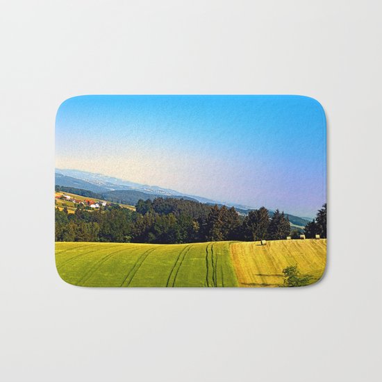 Tipping the scenery Bath Mat