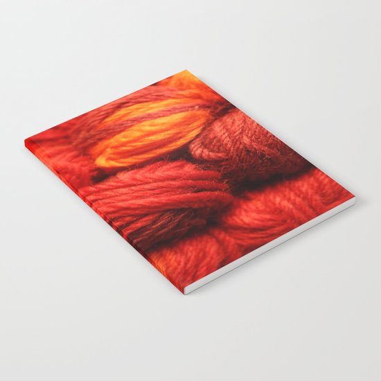Many Balls of Wool in Shades of Red Notebook