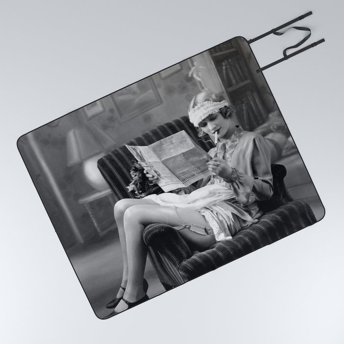The funny papers; roaring twenties flapper in garter belt and stockings reading newspaper and smoking cigarette portrait black and white vintage photograph - photography - photographs Picnic Blanket