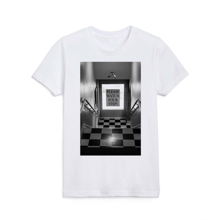 Please watch your step! humorous funny black and white photograph - photography - photographs with stairs and checkerboard floor Kids T Shirt