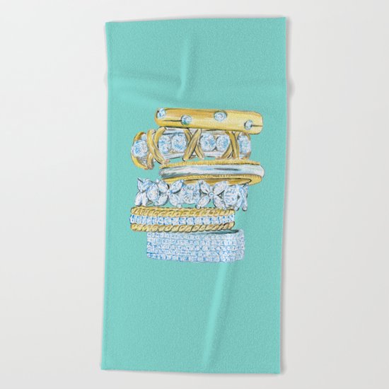 Golden Rings on Blue Beach Towel