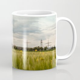 Landscape view of the electric tower over the rapeseed plantation in Germany Coffee Mug