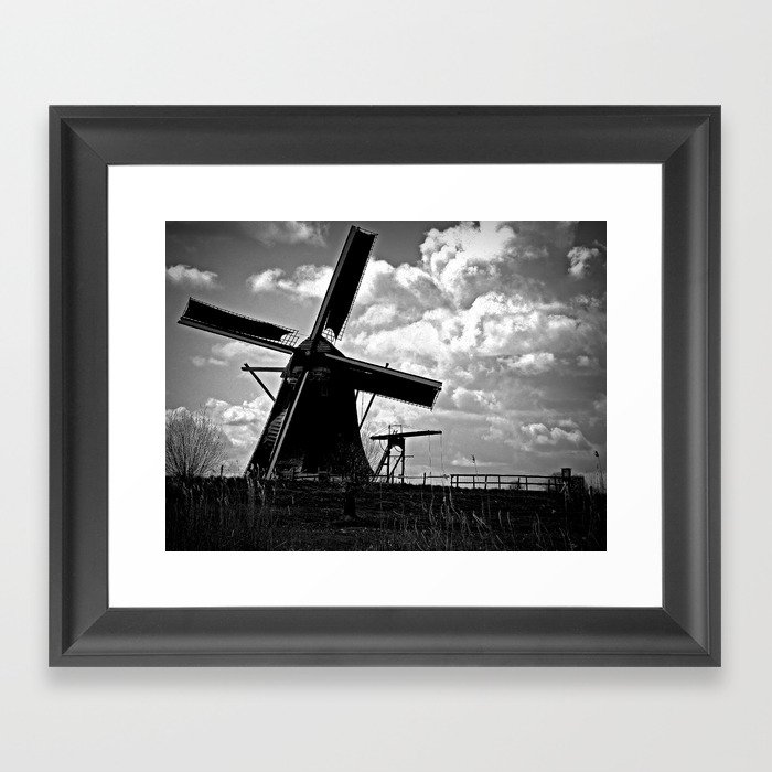 Traditional Dutch Windmill with dramatic clouds and sky  Framed Art Print