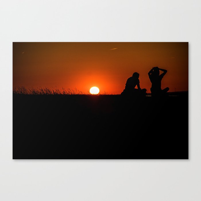 Romantic date in the sunset Canvas Print