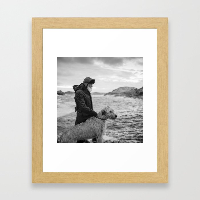 The man, the sea, the hound. Framed Art Print
