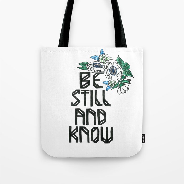 Hand-lettered bible verse "be still and know" with blue flowers Tote Bag