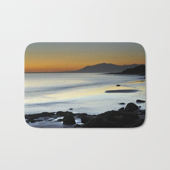 "Serenity beach". Orange sunset Bath Mat
