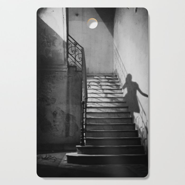 Ghosts and shadows of Paris lonely female shadow figure walking up stairs black and white photograph, photograhy, photographs Cutting Board