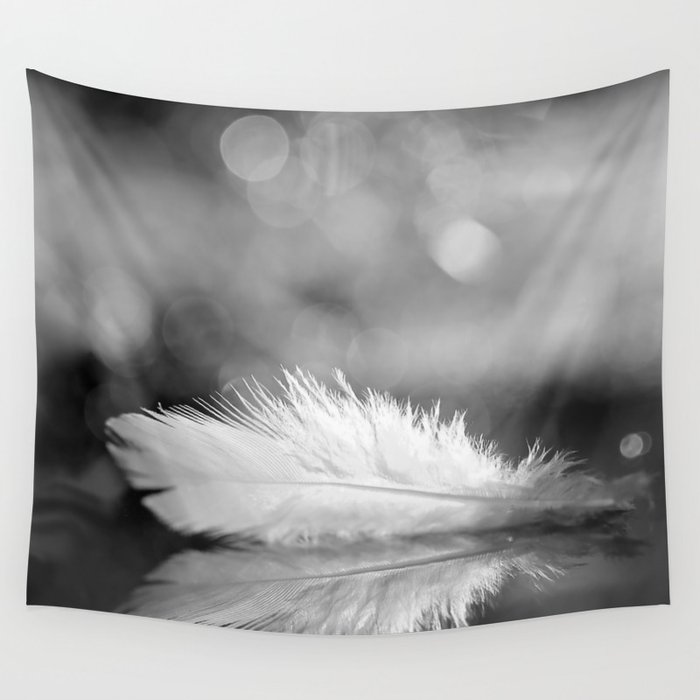 White Feather In Black And White Bokeh Background #decor #society6 #buyart Wall Tapestry