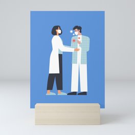 Female nurse taking care of sick man patient cartoon illustration Mini Art Print