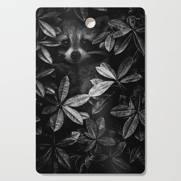 I spy - under cover of the night; baby raccoon spying in the ivy at night wilderness nature animal black and white photograph - photography - photographs Cutting Board