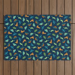 Dinosaur Tumble - green, rust and teal on navy by Cecca Designs Outdoor Rug