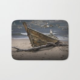 Gulls Flying over a Shipwrecked Wooden Boat Bath Mat