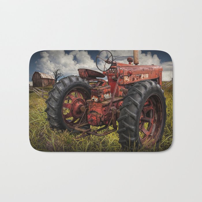 Abandoned Old Farmall Tractor In A Grassy Field On A Farm Bath Mat