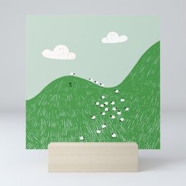 a hill full of sheep Mini Art Print