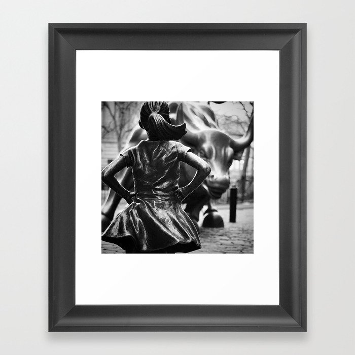 Fearless Girl facing down the Charging Bull statue of Wall Street black and white photography Framed Art Print