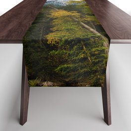 Transitions - Snowy Mountain Peak Overlooking Trees with Fall Color on Autumn Day in Glacier National Park Montana Table Runner