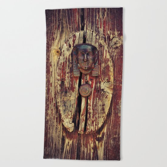 weathered wooden door with agypt door knocker Beach Towel