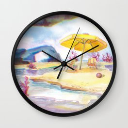 On the beach under a yellow umbrella Wall Clock