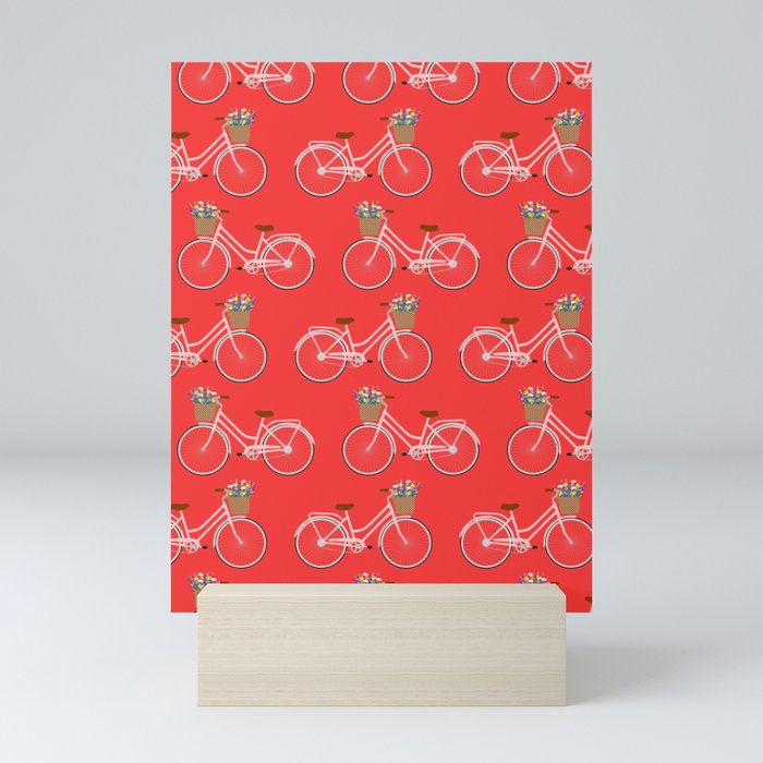 Bicycle with flower basket on red Mini Art Print