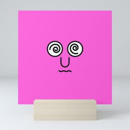 type face: Dizzy Emoji Pink Mini Art Print