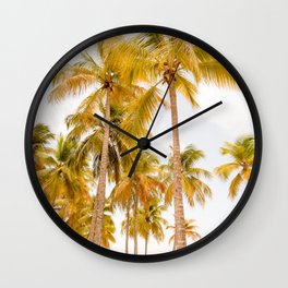 Palm trees against cloudy sky Wall Clock